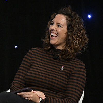 Jacqui Belleau laughing on stage